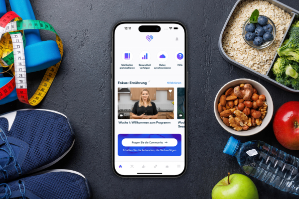 Die Gro Health App, umgeben von Sportartikeln und gesunden Lebensmitteln